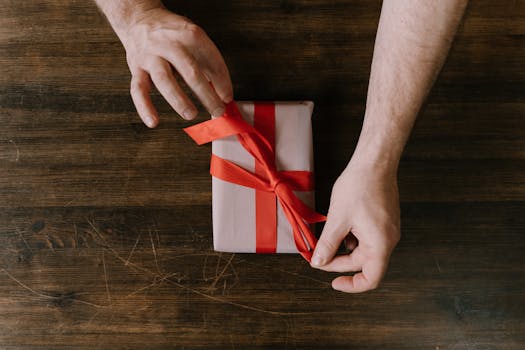 Person Holding a Red Ribbon